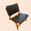 Low wooden chair with leather